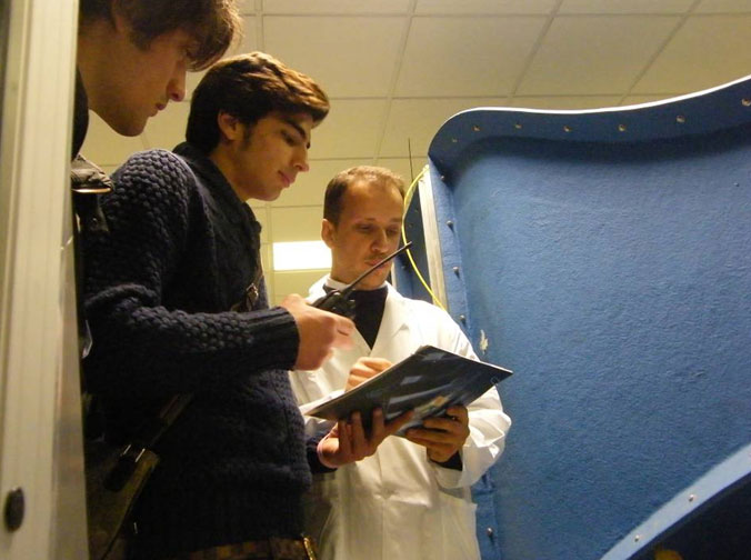The students performing the calibration of the wind gauge at the small subsonic wind tunnel test facility